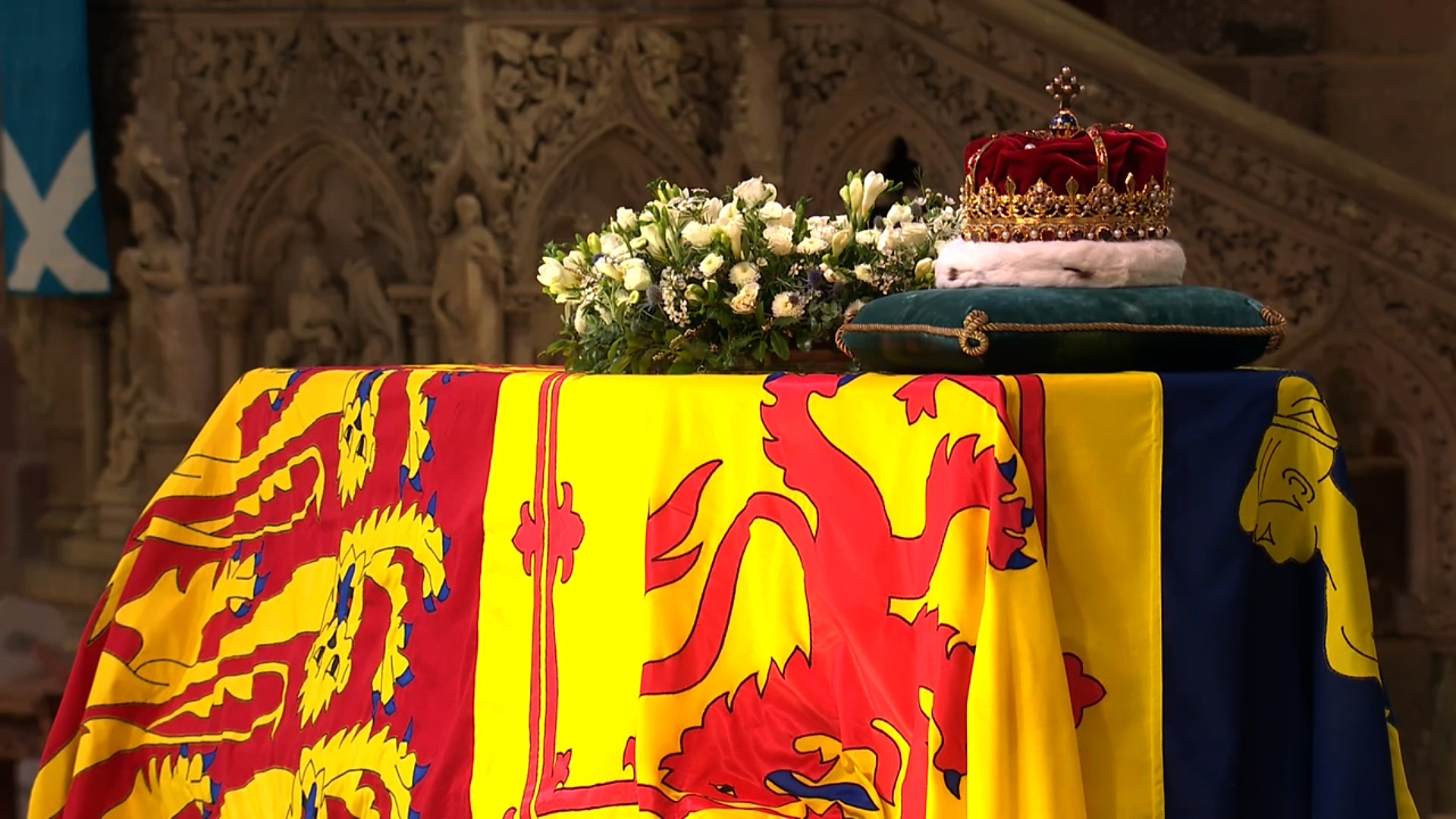 The Queen's coffin draped in flags