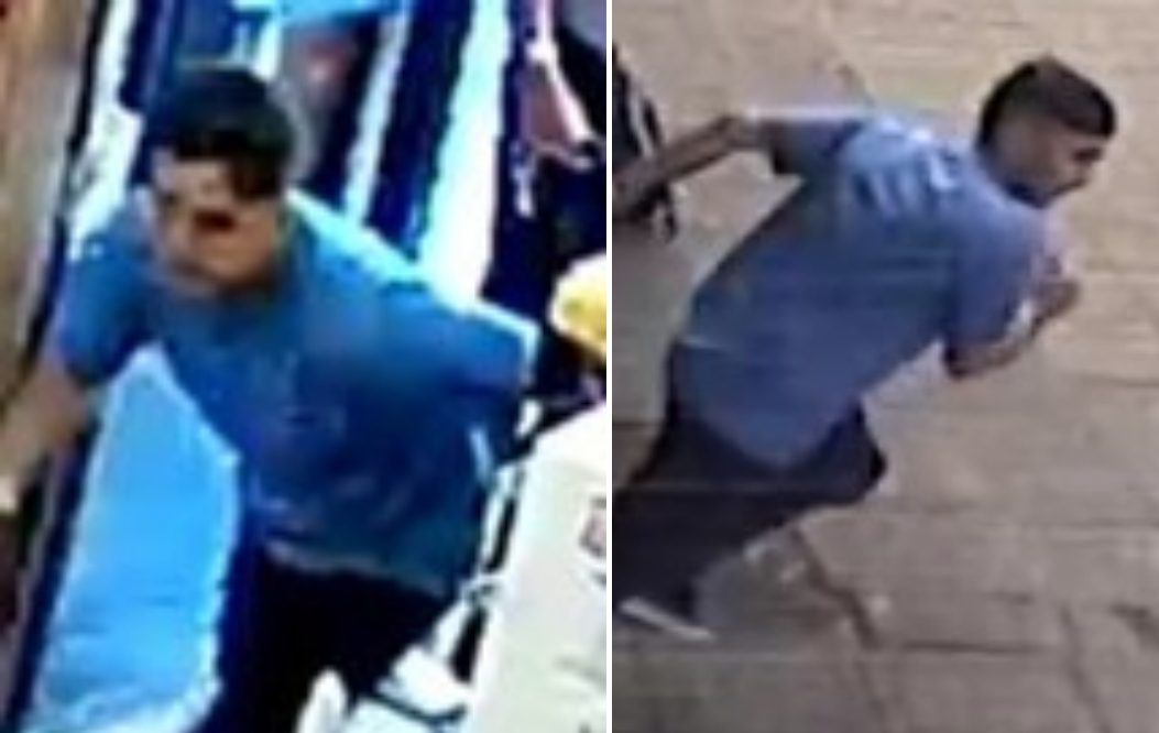 The first man was seen wearing a light blue t-shirt, dark trousers and dark shoes.