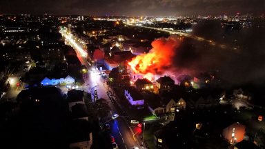 Rutherglen council offices next to petrol station on King Street engulfed in flames