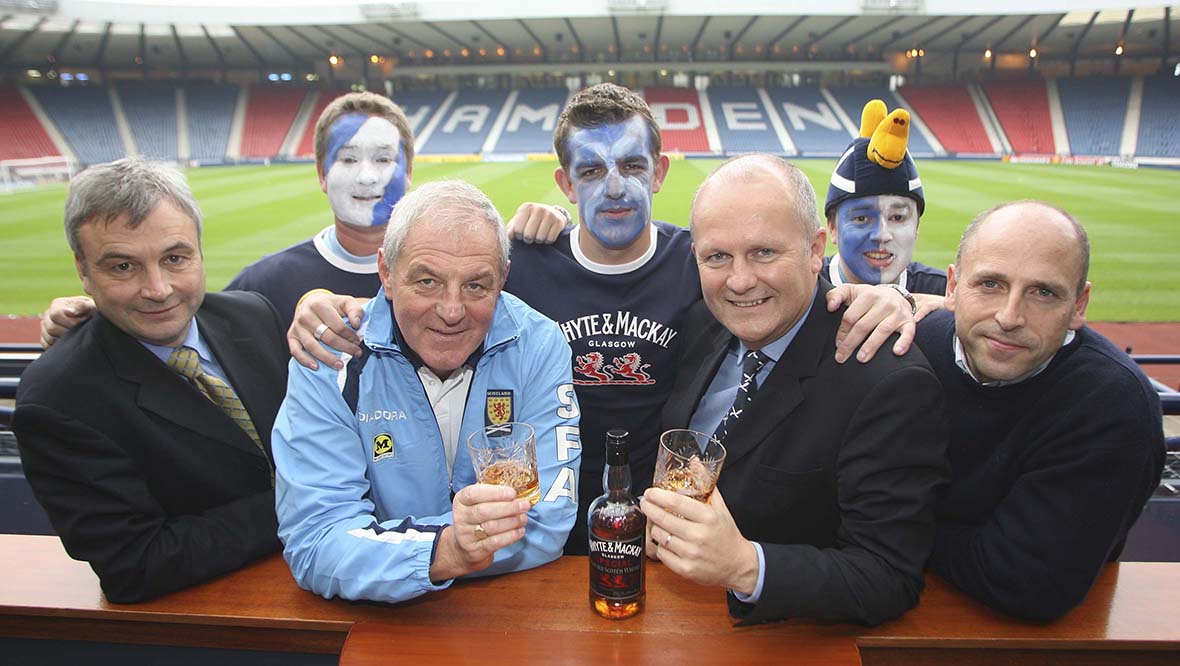 Hamish Husband (far right) has travelled all over the world supporting Scotland.