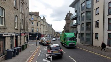 Pensioner left ‘badly shaken’ after being robbed by masked man on Dundee street