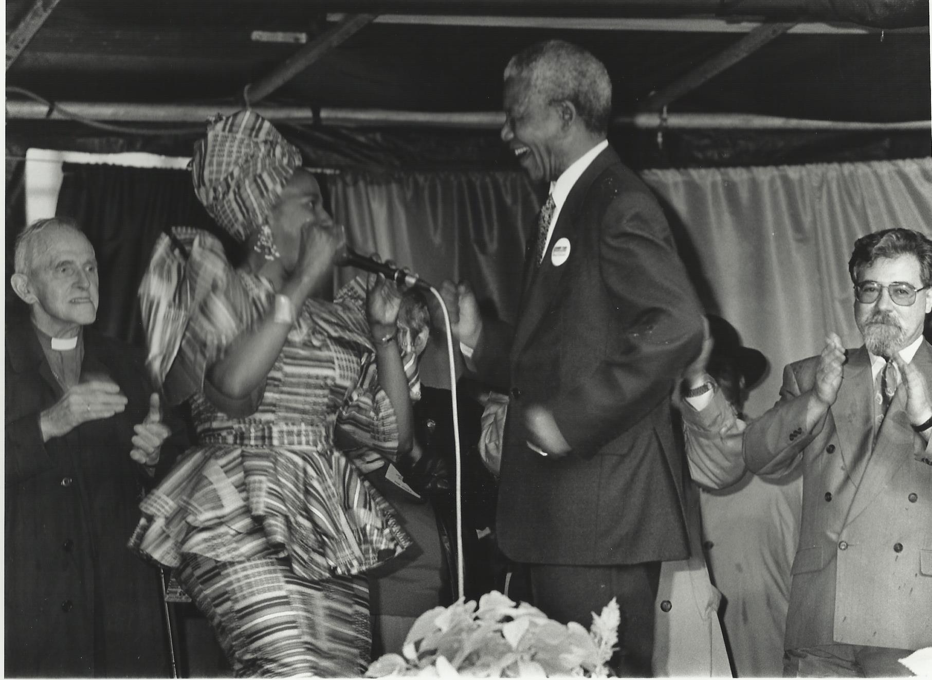 Nelson Mandela dances with Marah Louw at rally in George Square, Glasgow, October 9, 1993.
