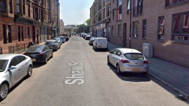 Man arrested and another taken to hospital after street assault