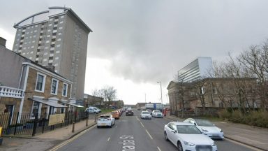 Man dies after falling from building on Hamilton street as police carry out probe