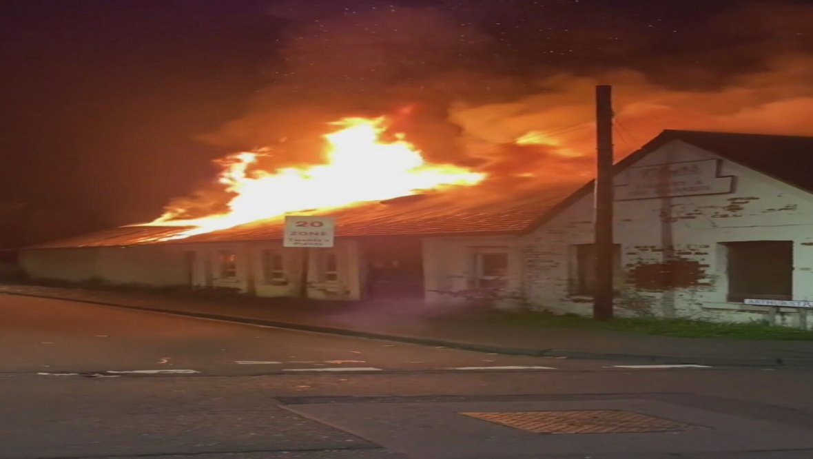 Fire crews tackle huge blaze at laundrette as public asked to avoid area