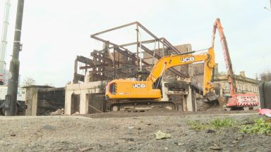 Demolition of Robertson’s underway after massive fire