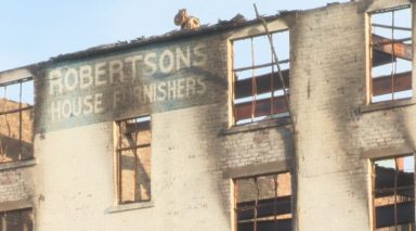 Bulldozers move in on fire-ravaged Art Deco city centre furniture shop