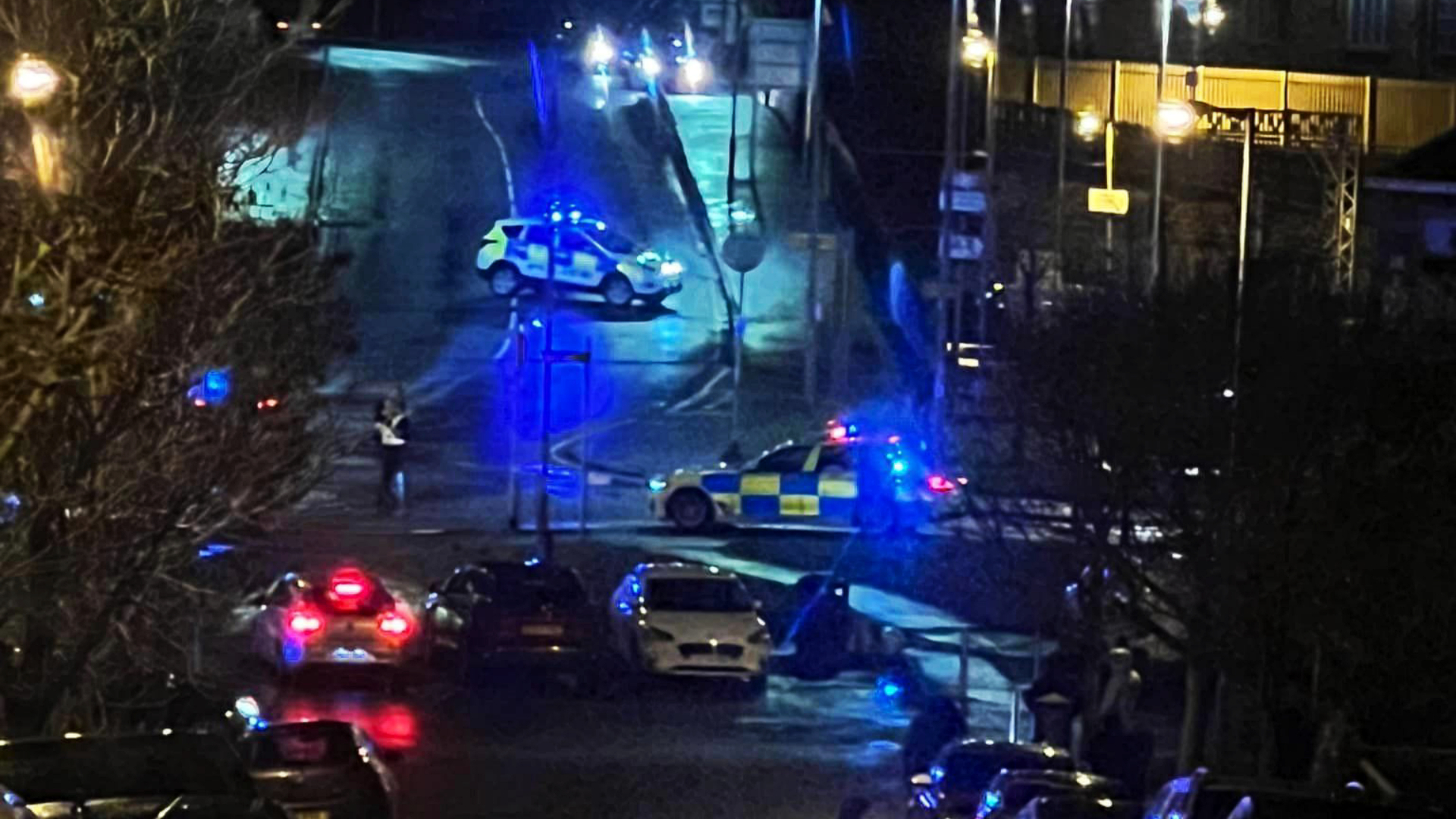 Three people have been taken to hospital after a car was crushed under a tractor.