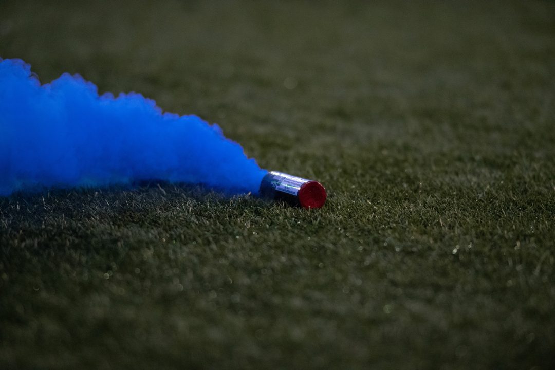 Australian football fans charged over pitch invasion after goalkeeper injured during Melbourne derby