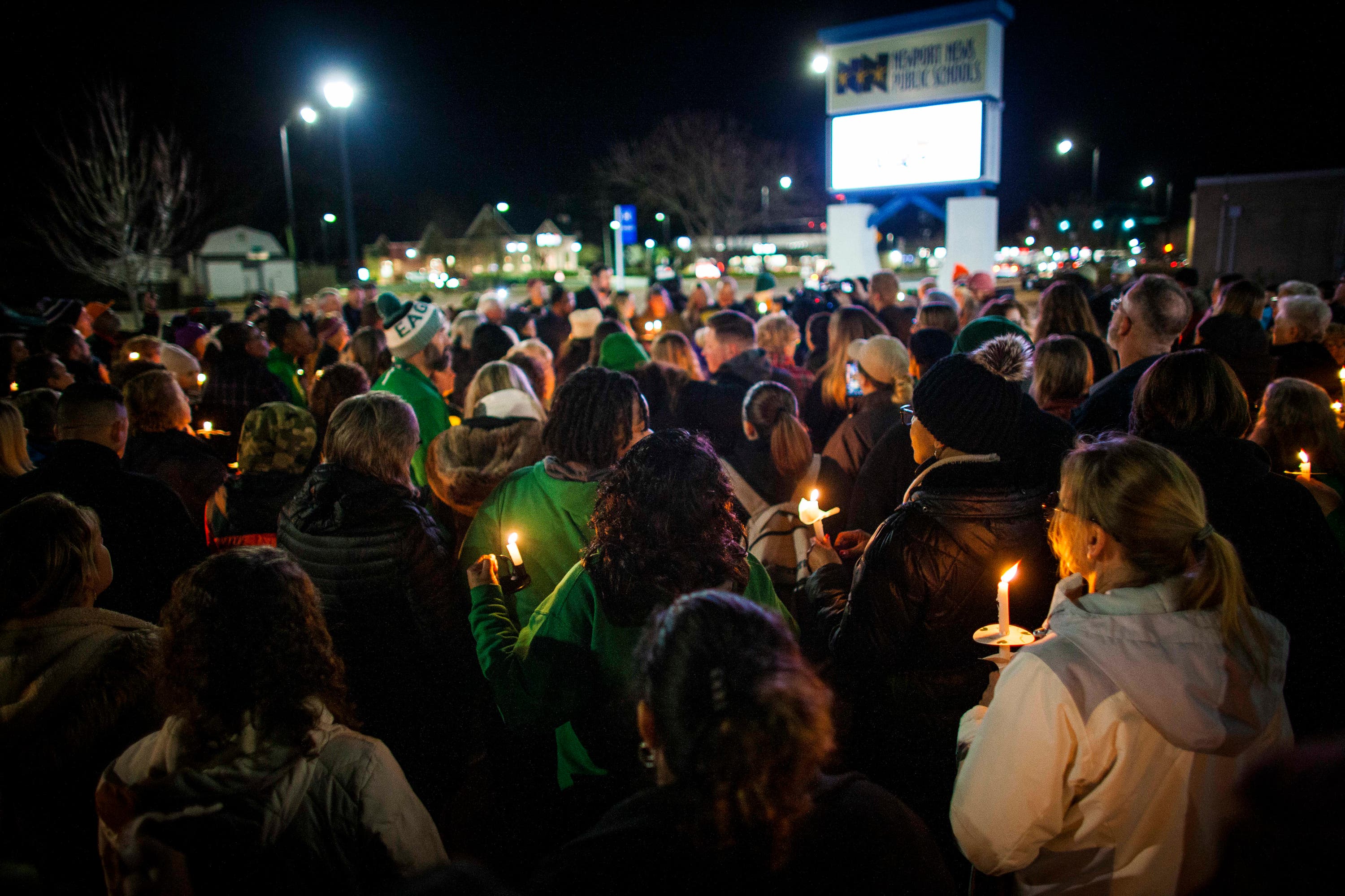 Residents of Newport News hold a candlelight vigil for Ms Zwerner.