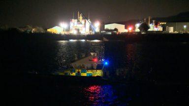 Coastguard stands down from rescue after tugboat carrying two capsizes