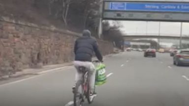 Police search for man filmed cycling on M8 motorway in Glasgow with Asda shopping bag