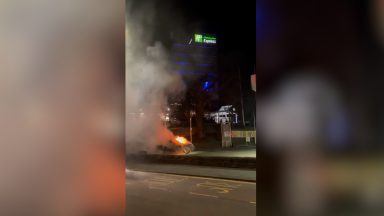Fire crews battle blaze after car catches fire outside petrol station in Edinburgh