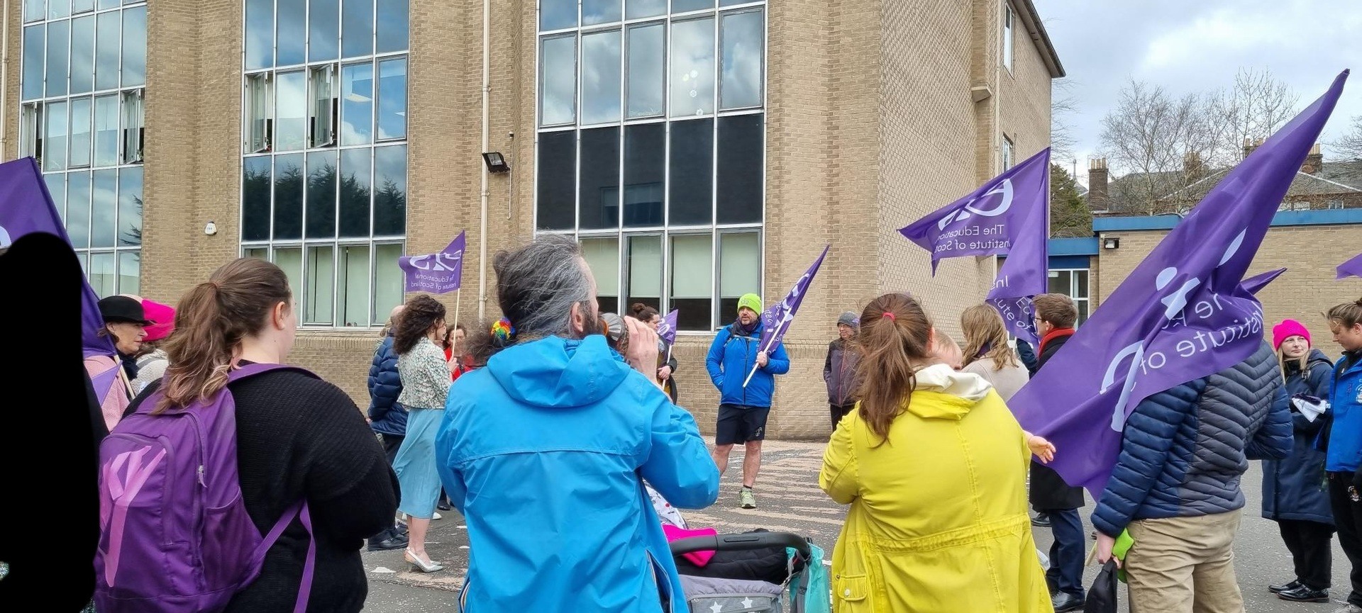 Teachers at Hutchesons’ Grammar hold a car-park union meeting in opposition to the school’s plans to ‘fire and rehire’ teachers on new contracts with inferior pension provision.