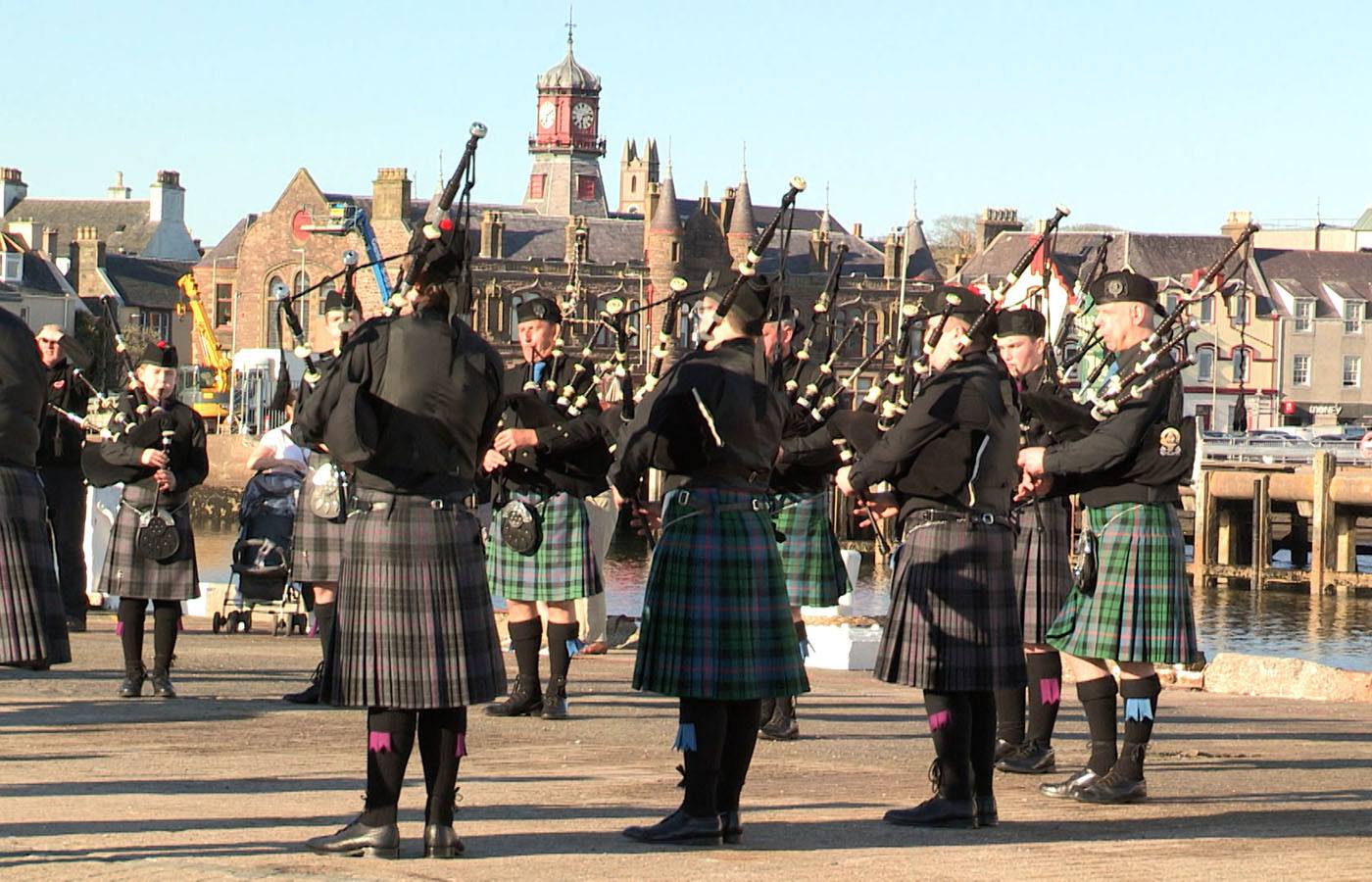 Pipe band performing at commemoration ceremony in Stornoway.