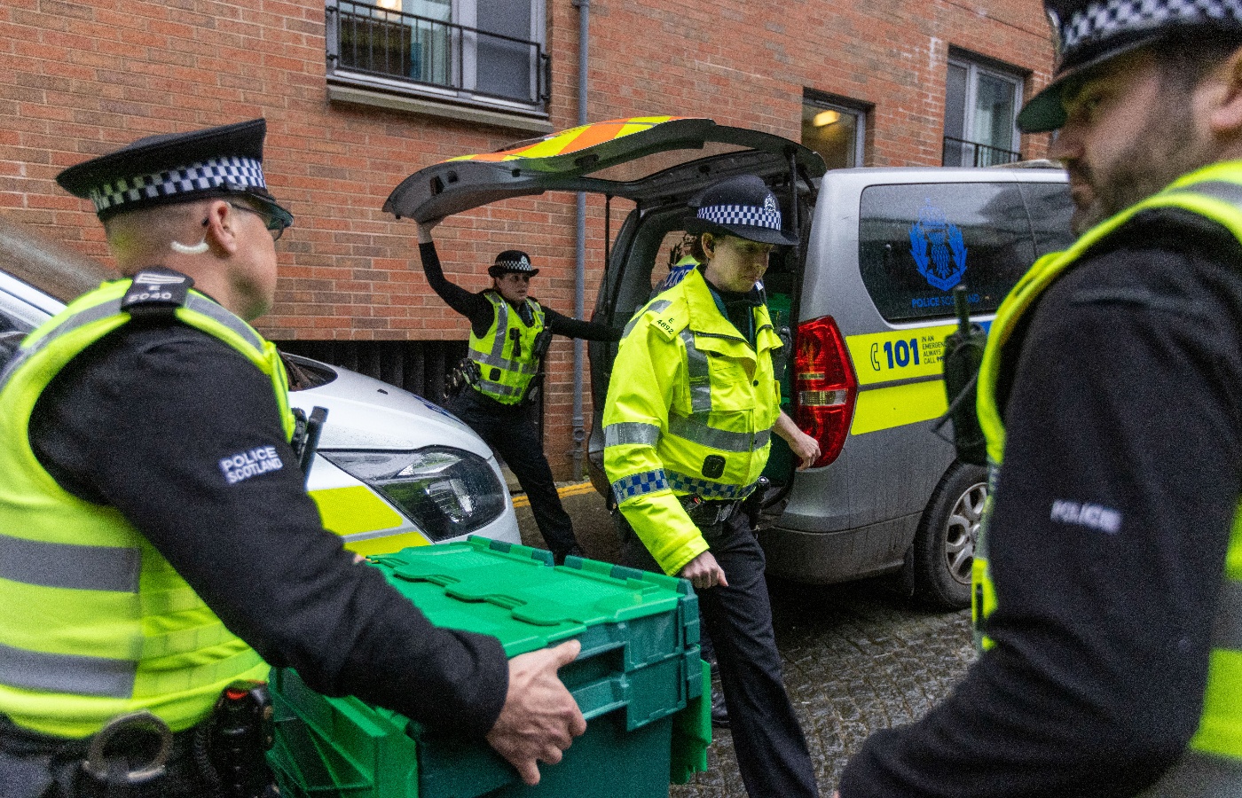 Police Scotland were seen taking several large boxes from the SNP's HQ in Edinburgh on the day the party's former chief executive was arrested.