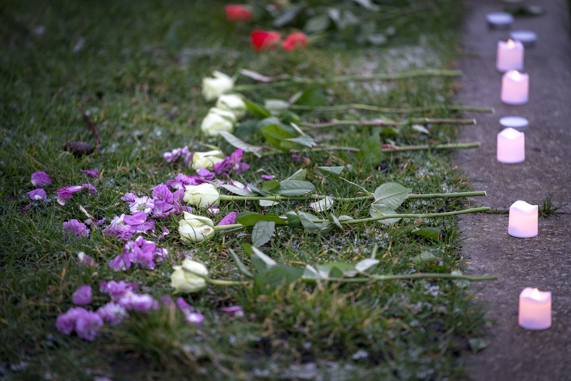 Flowers and candles were placed at a vigil in memory of Fawziyah Javed.