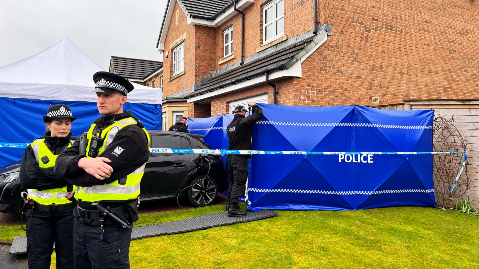 A forensic tent was erected outside the former first minister's home in Uddingston last year.