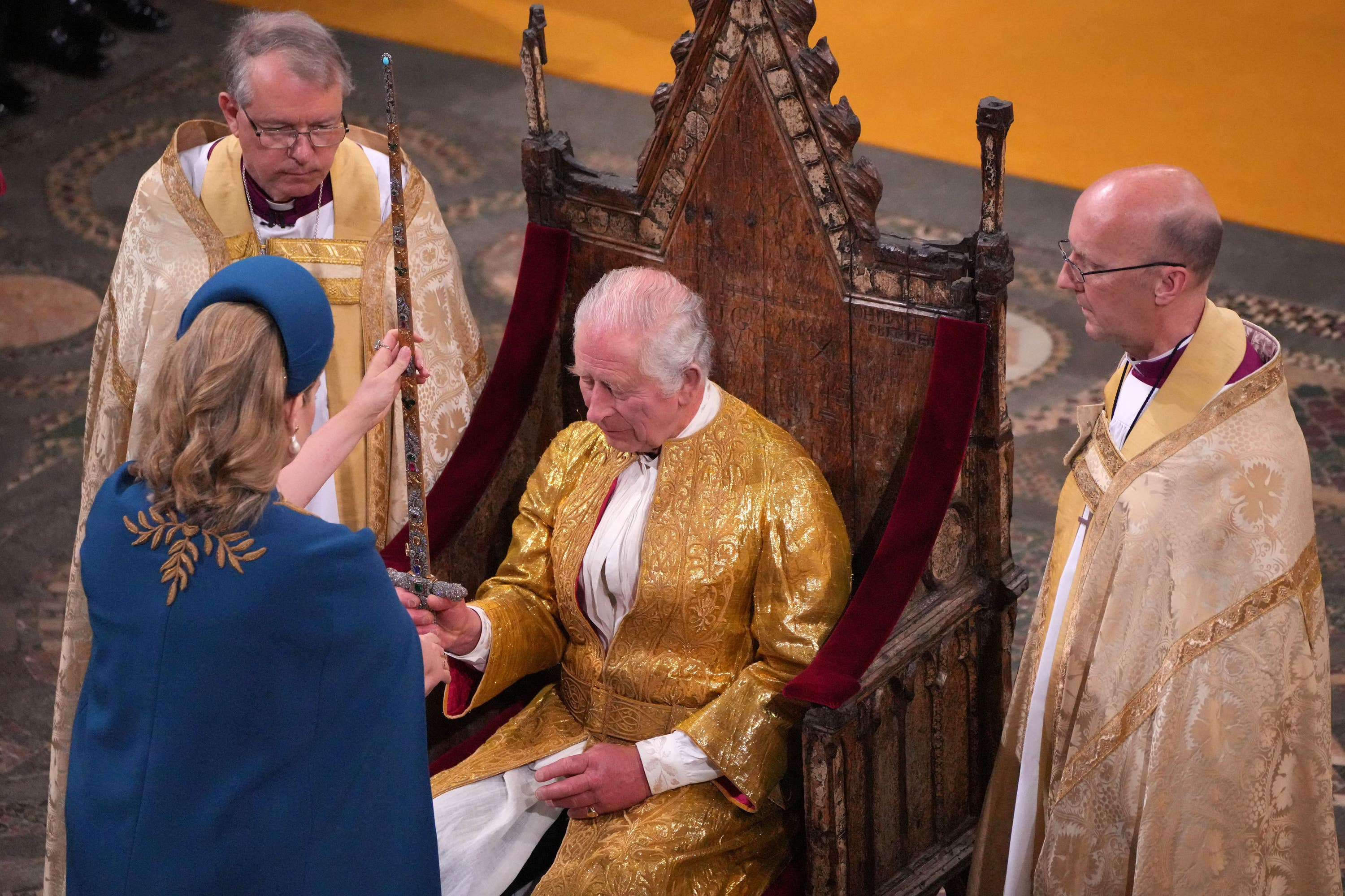 Penny Mordaunt presenting the sword to Charles.