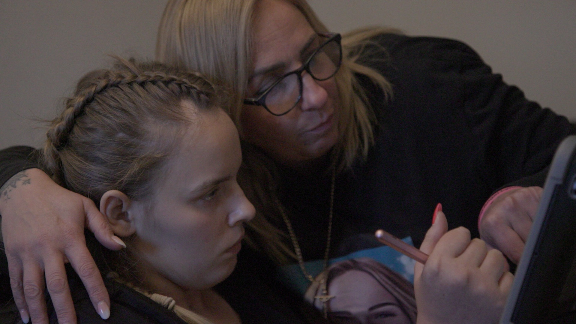 Angel Lynn and her mother Nikki playing a game at their home in Leicester.