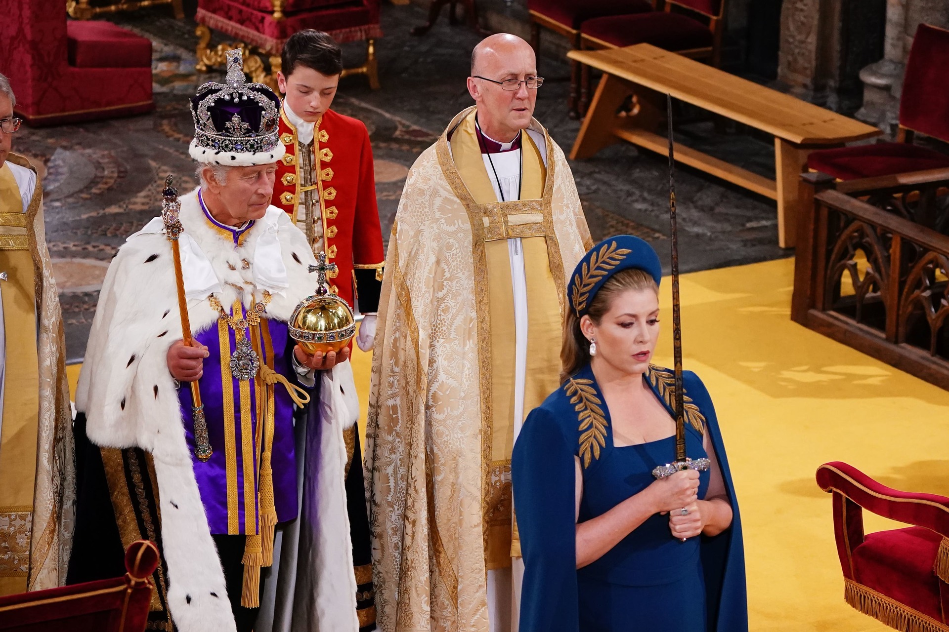 Penny Mordaunt walking ahead of the King.