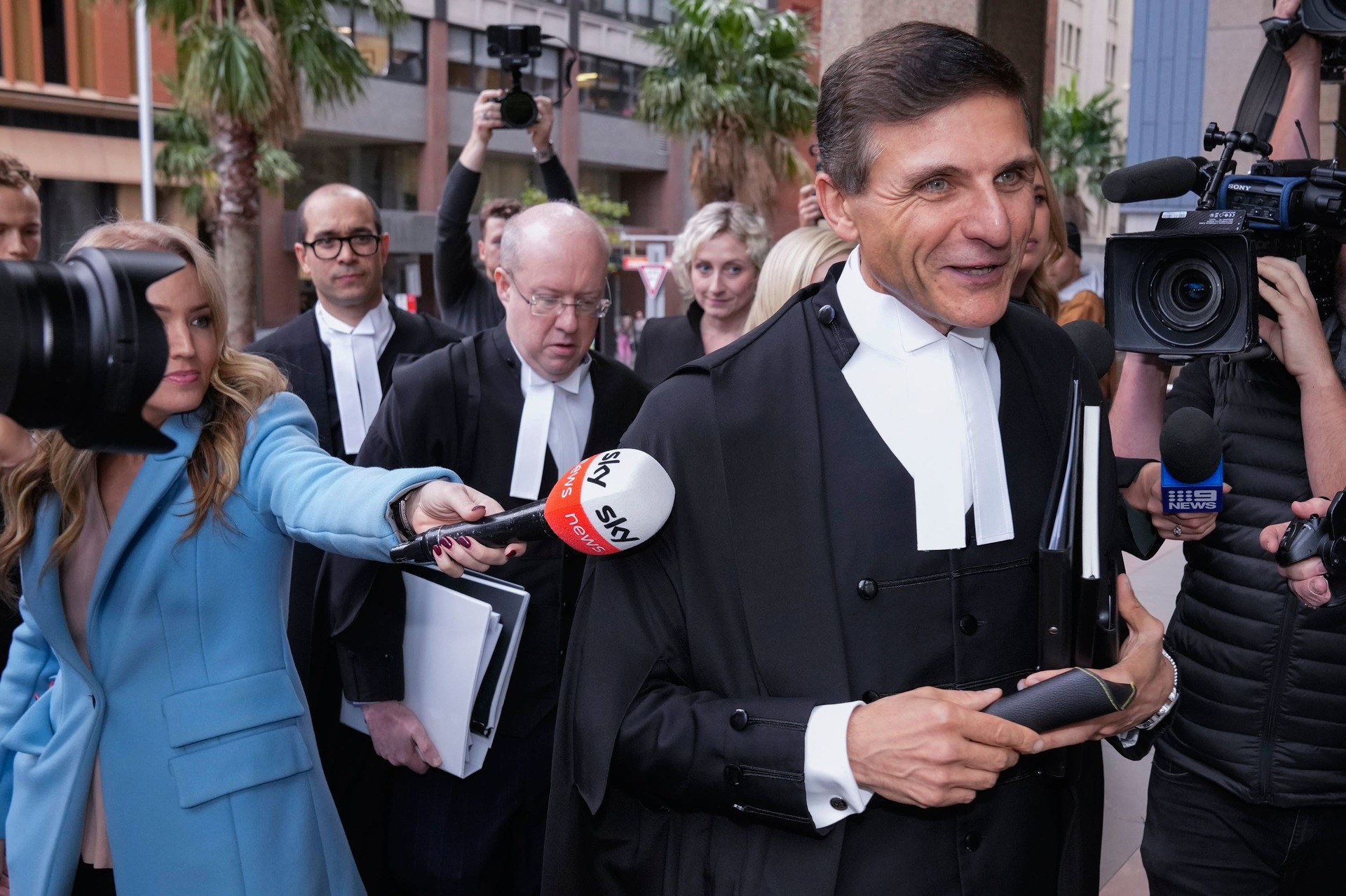 Arthur Moses, lawyer for Victoria Cross recipient Ben Roberts-Smith, and his legal team walk into court (Mark Baker/AP) 