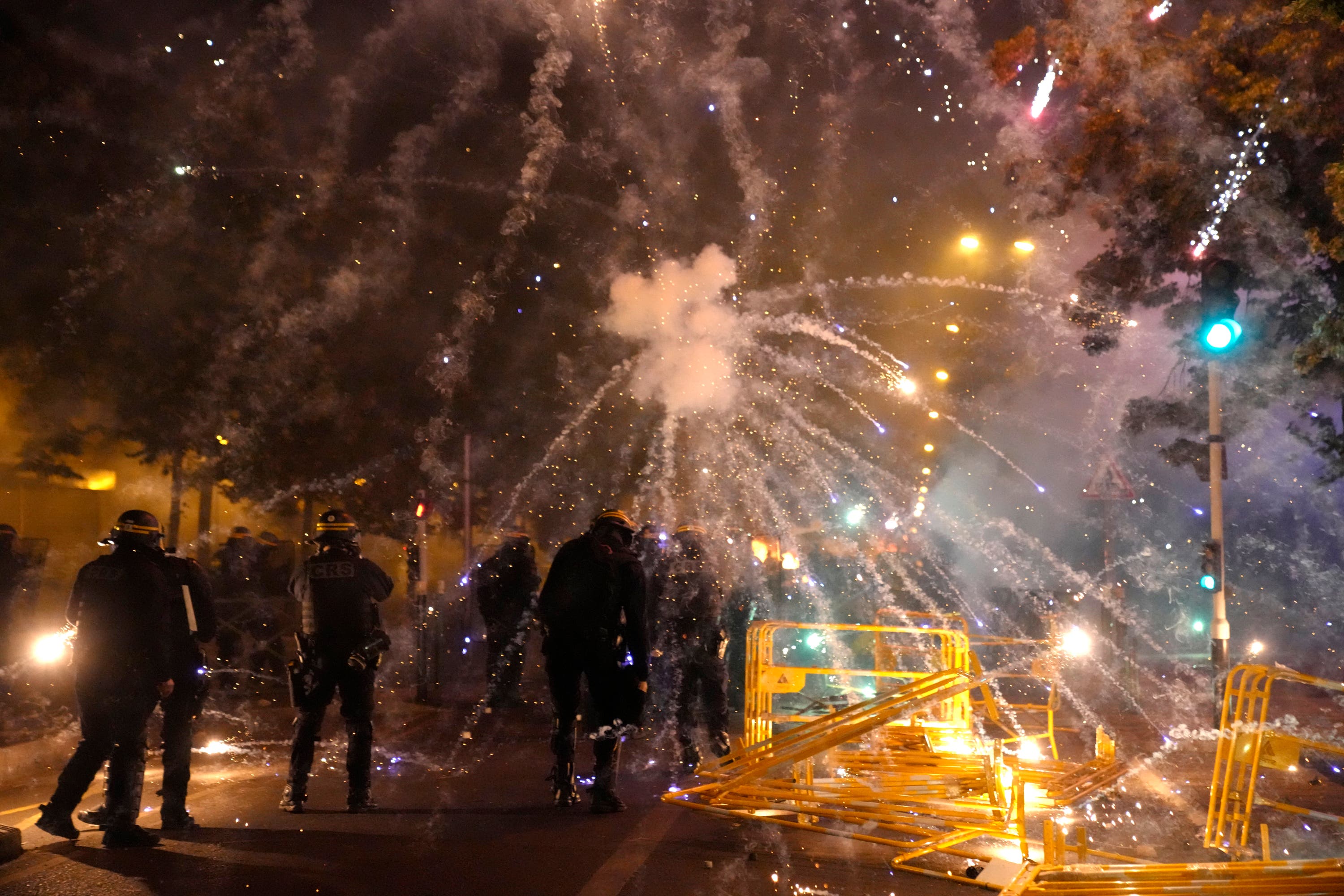 Police forces clash with youths in Nanterre near Paris on Thursday.