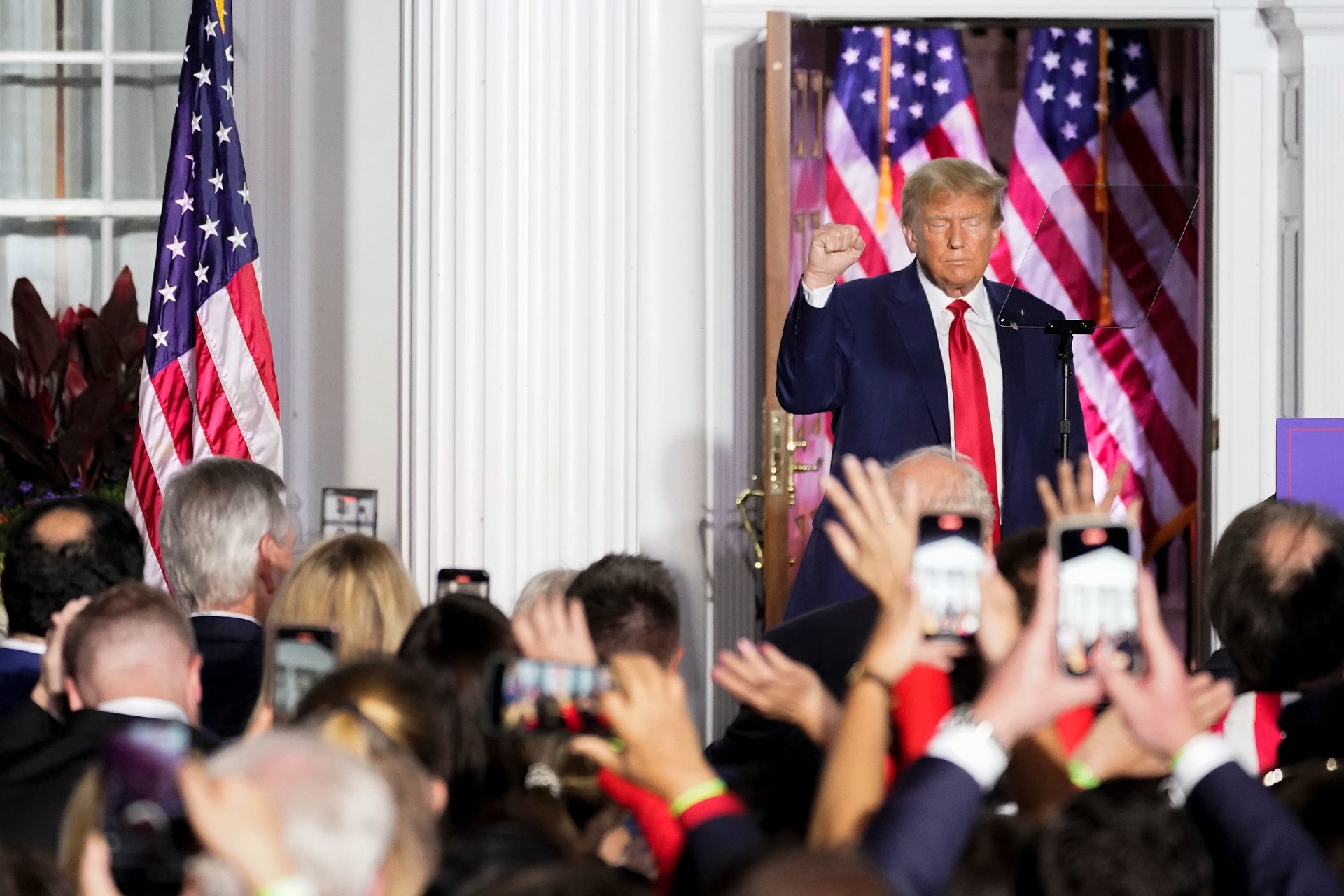 Former president Donald Trump motions after speaking to supporters at Trump National Golf Club Bedminster on Tuesday.