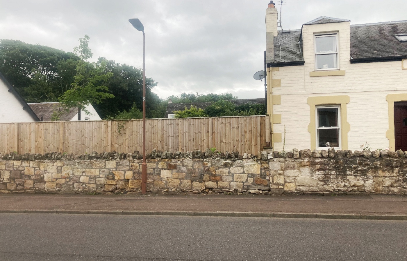 Fence replaced 20ft high hedge but was deemed unacceptable by council officers.