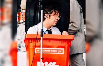 The 1975 frontman Matty Healy arrives in red wheelie bin to perform TRNSMT set