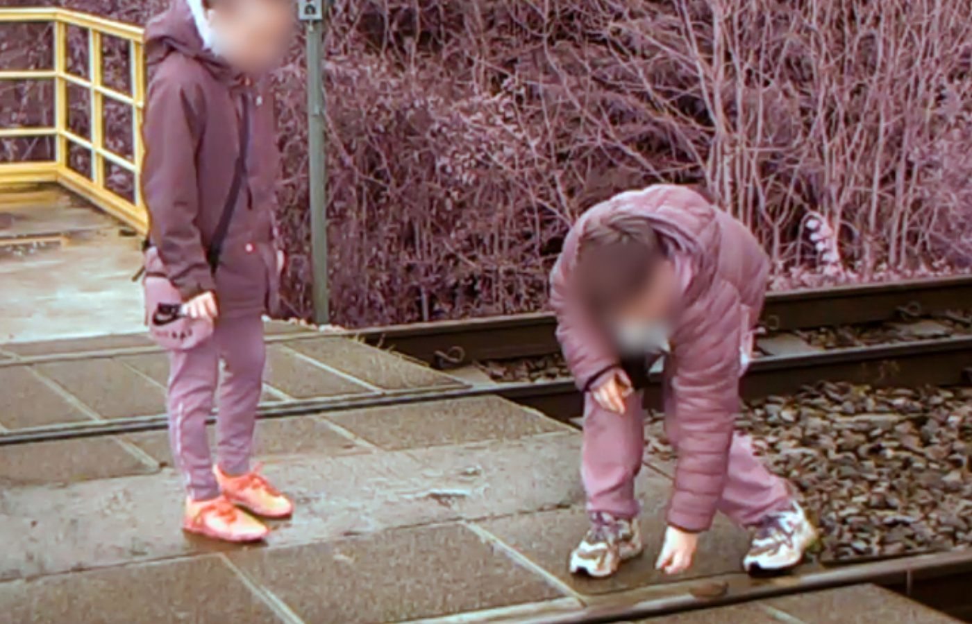 Another clip a shows two boys placing ballast stones on the lines.