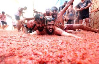 Revellers hurl tomatoes at each other in Spanish town’s Tomatina party