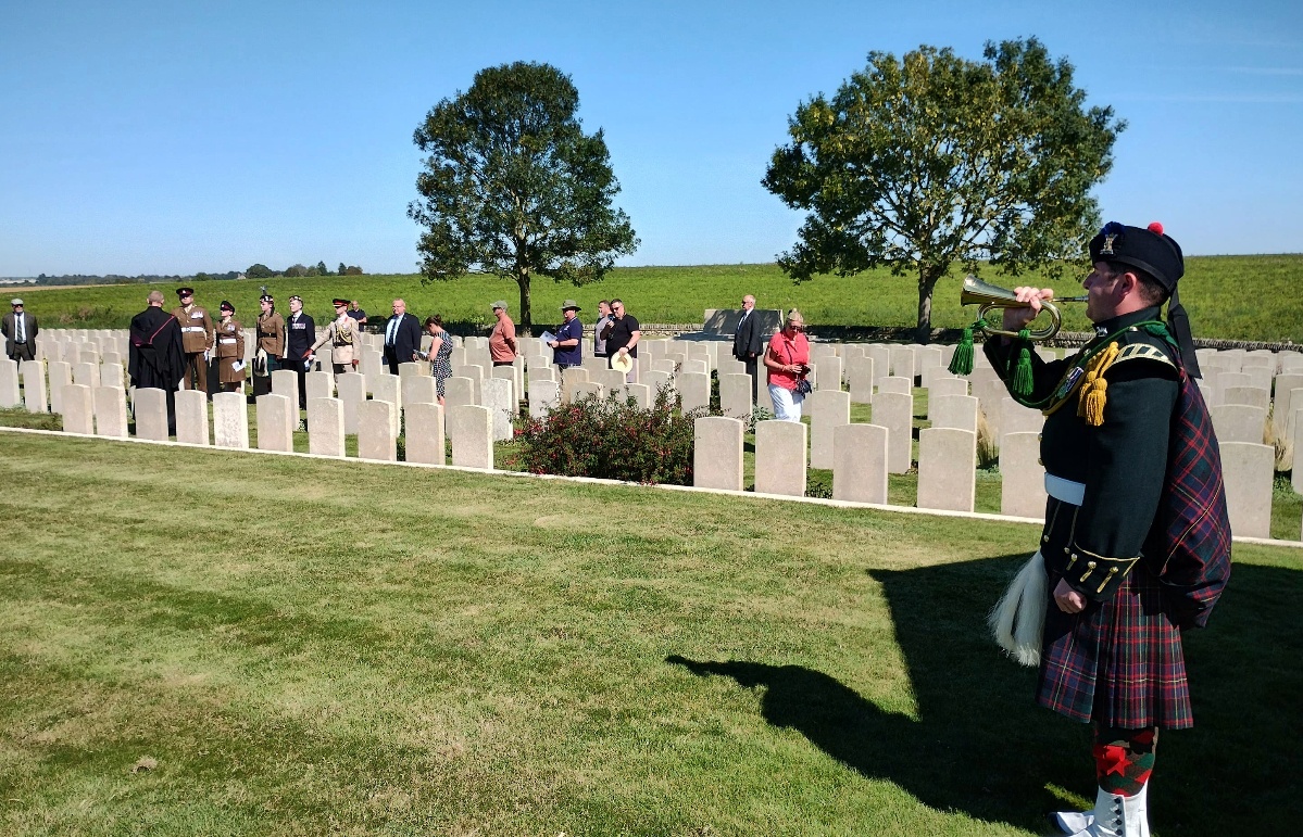 Adam Grant plays the Last Post at the rededication service for Pte Little (MOD/PA). 