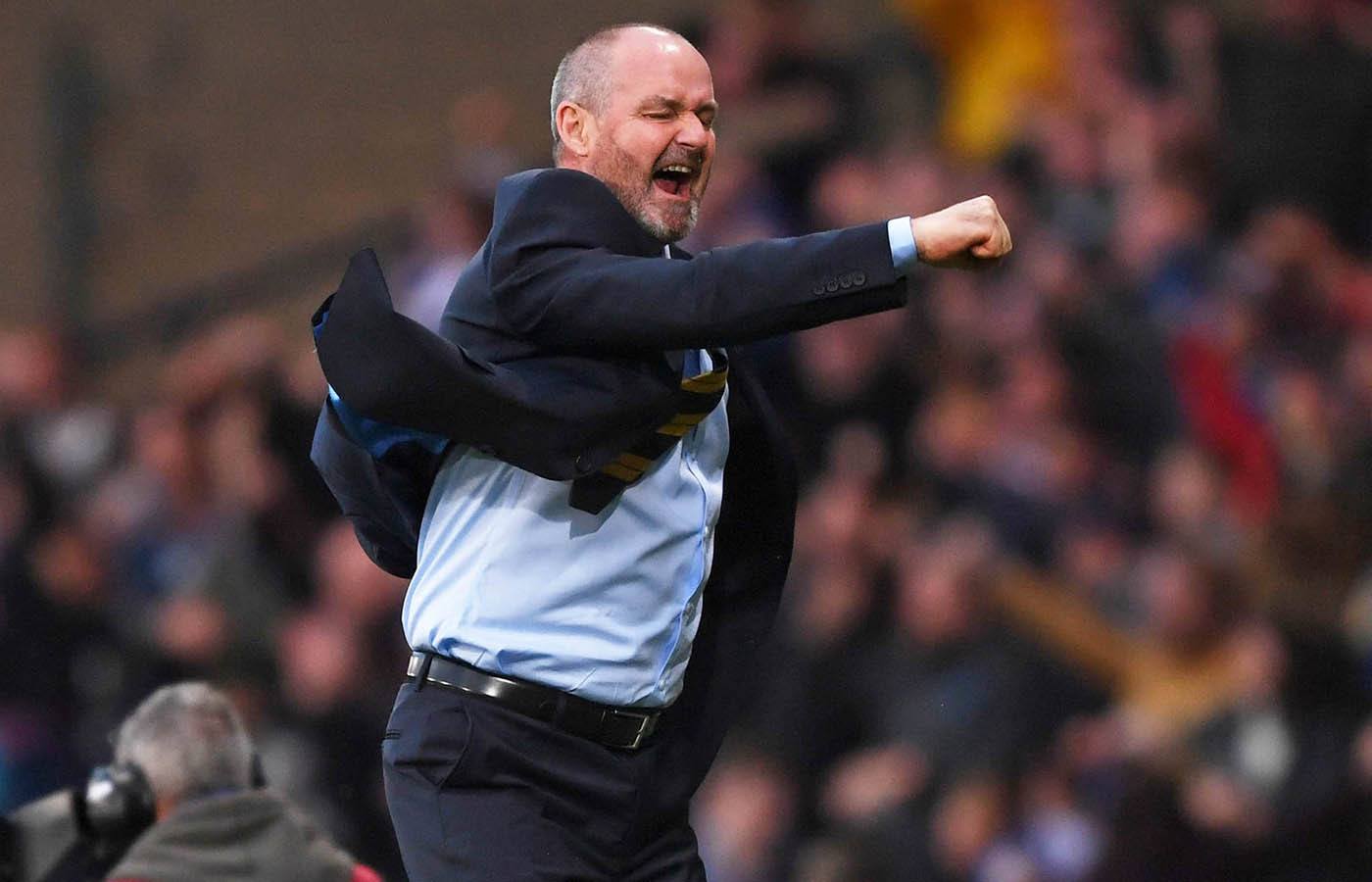 Clarke celebrating a late-winner against Cyprus in his first match in charge.