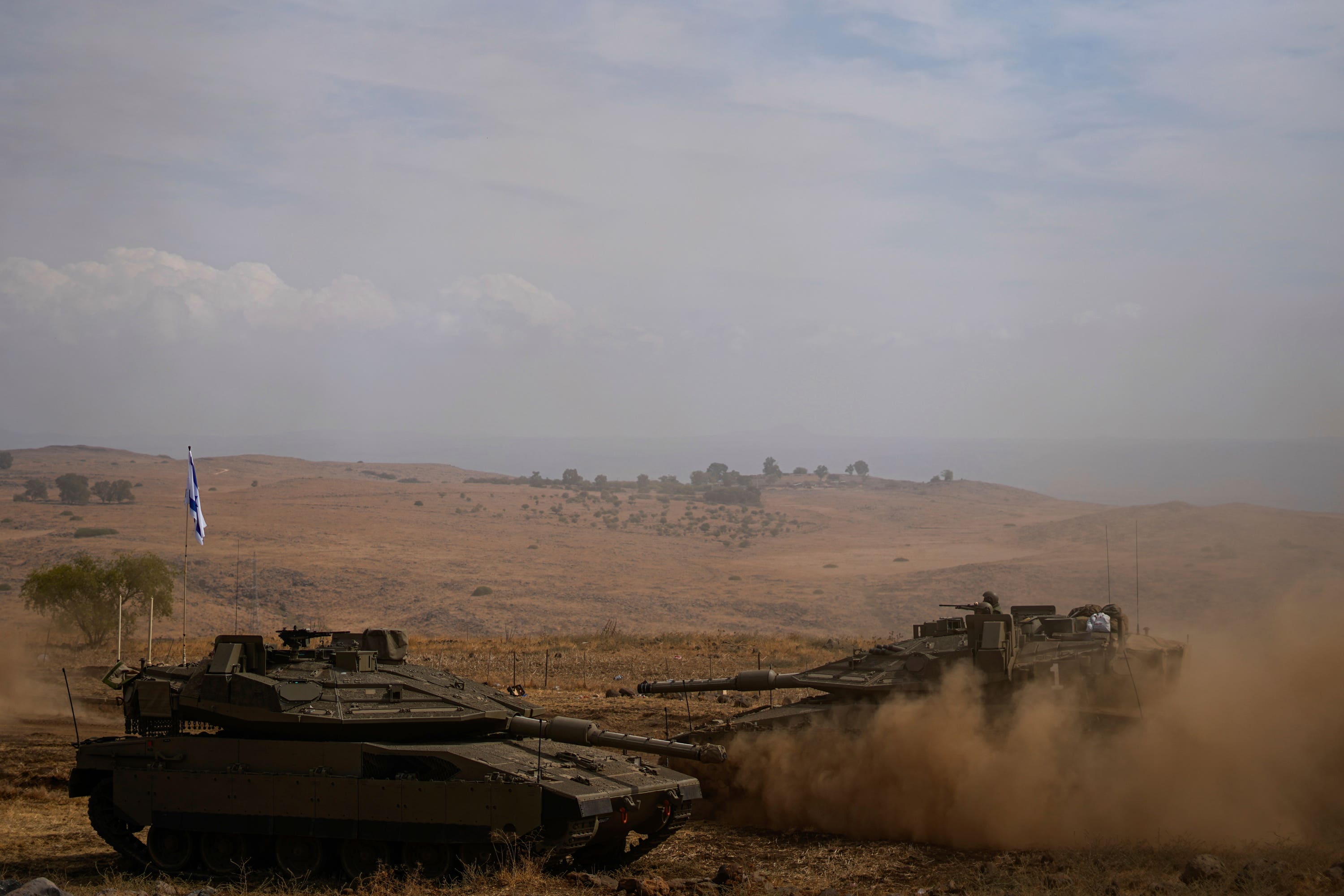 Israeli tanks were stationed near the border with Lebanon.