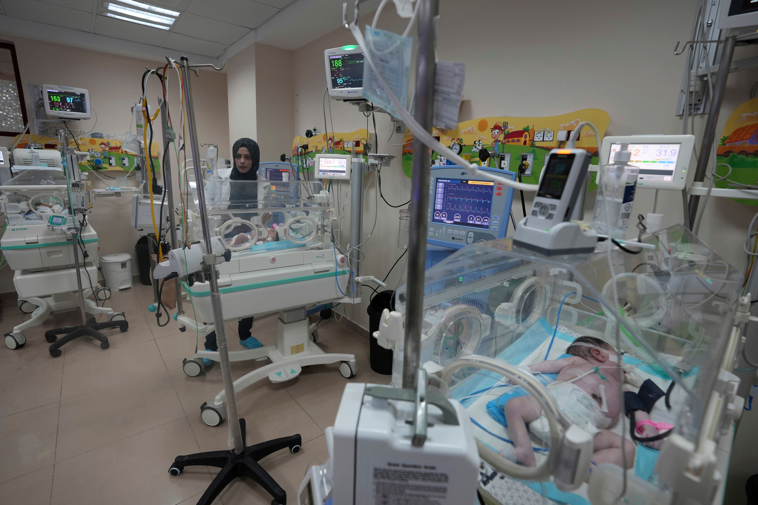 Palestinian doctors treat a premature baby at Al Aqsa Hospital in Deir el-Balah, Gaza Strip.