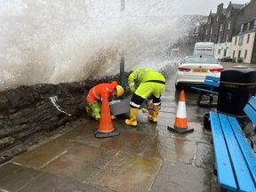 Watch engineers engulfed by waves in battle to fix damaged supply box