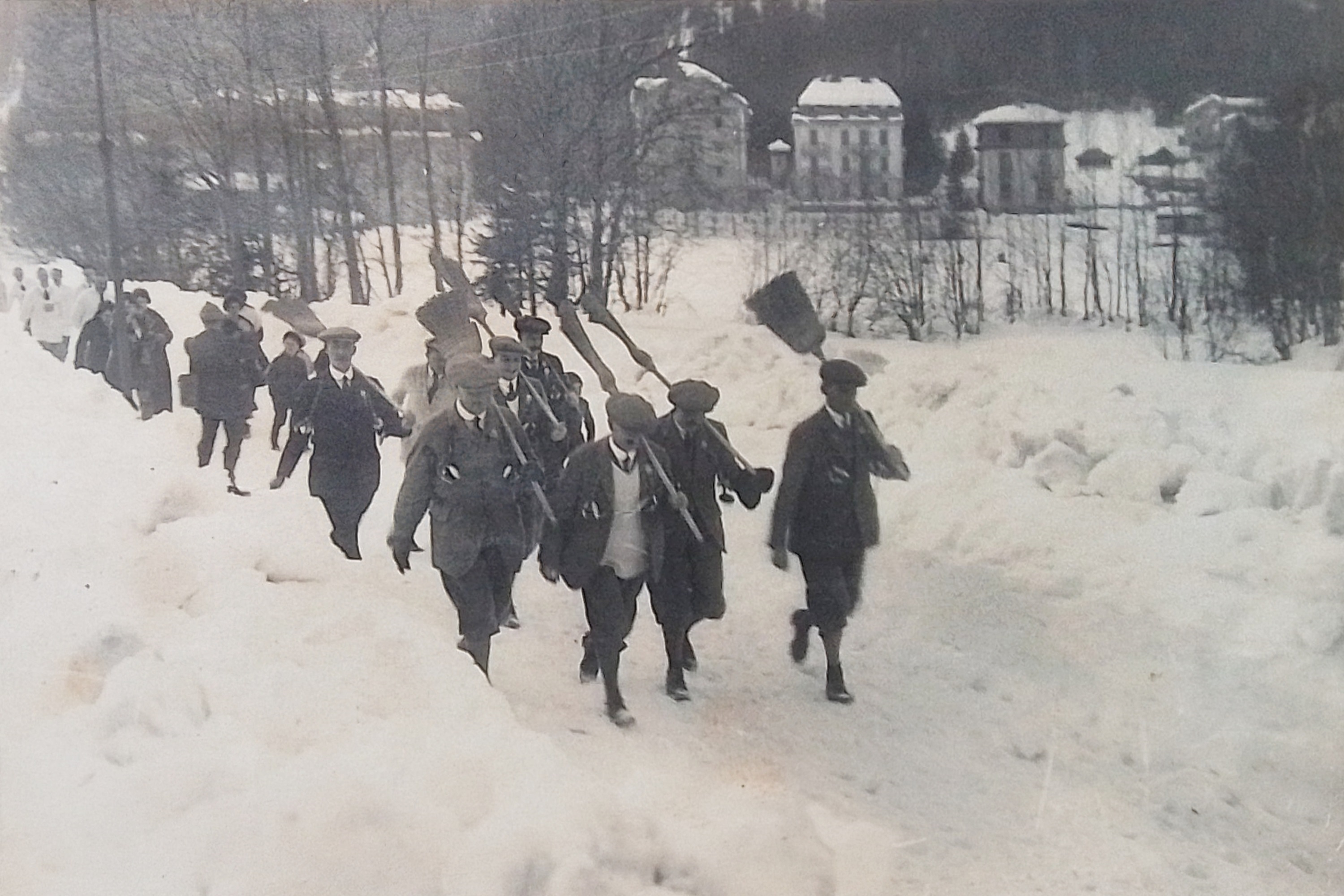 The curling team march into the arena in Charmonix 