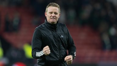 Barry Robson applauds Aberdeen players after Viaplay Cup semi-final win over Hibs