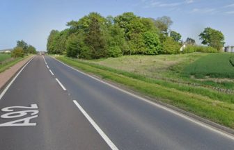 Woman taken to hospital and A92 closed after crash near Luthrie