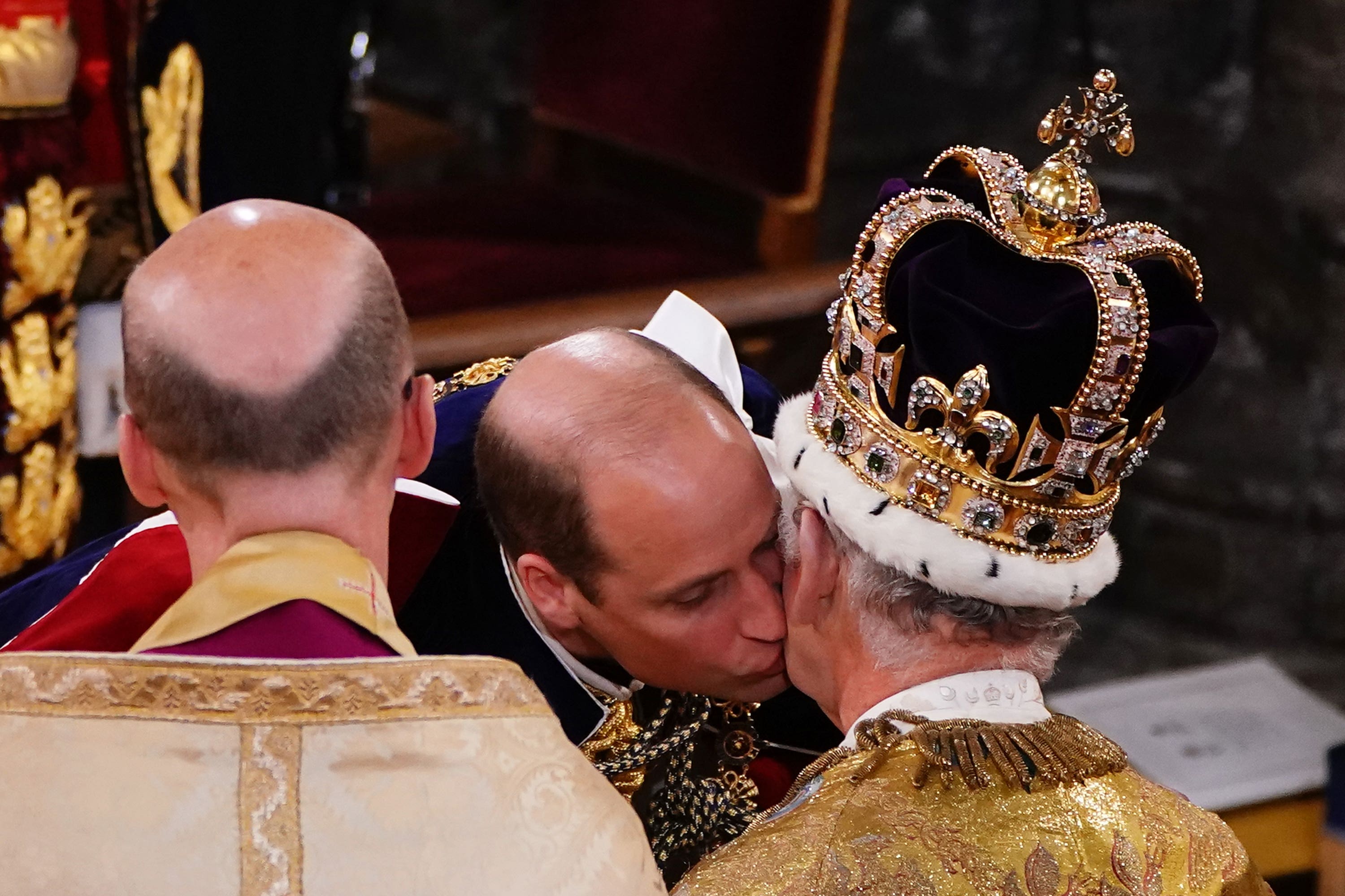 The Prince of Wales kisses his father the King during the coronation ceremony at Westminster Abbey (Yui Mok/PA). 
