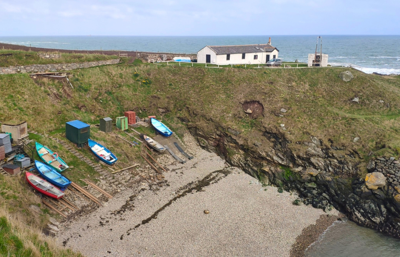 Fishing station and iron and steel cableways which were used to lift nets, gear, and fish from coves to the top of steep cliffs.