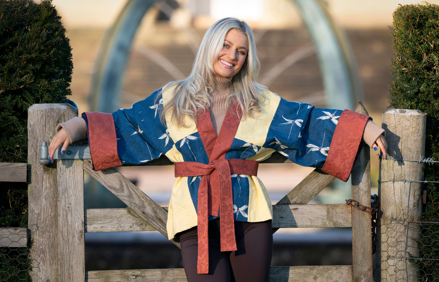 A bold denim blue and yellow damask short kimono made out of old royal curtains (Jane Barlow/PA).