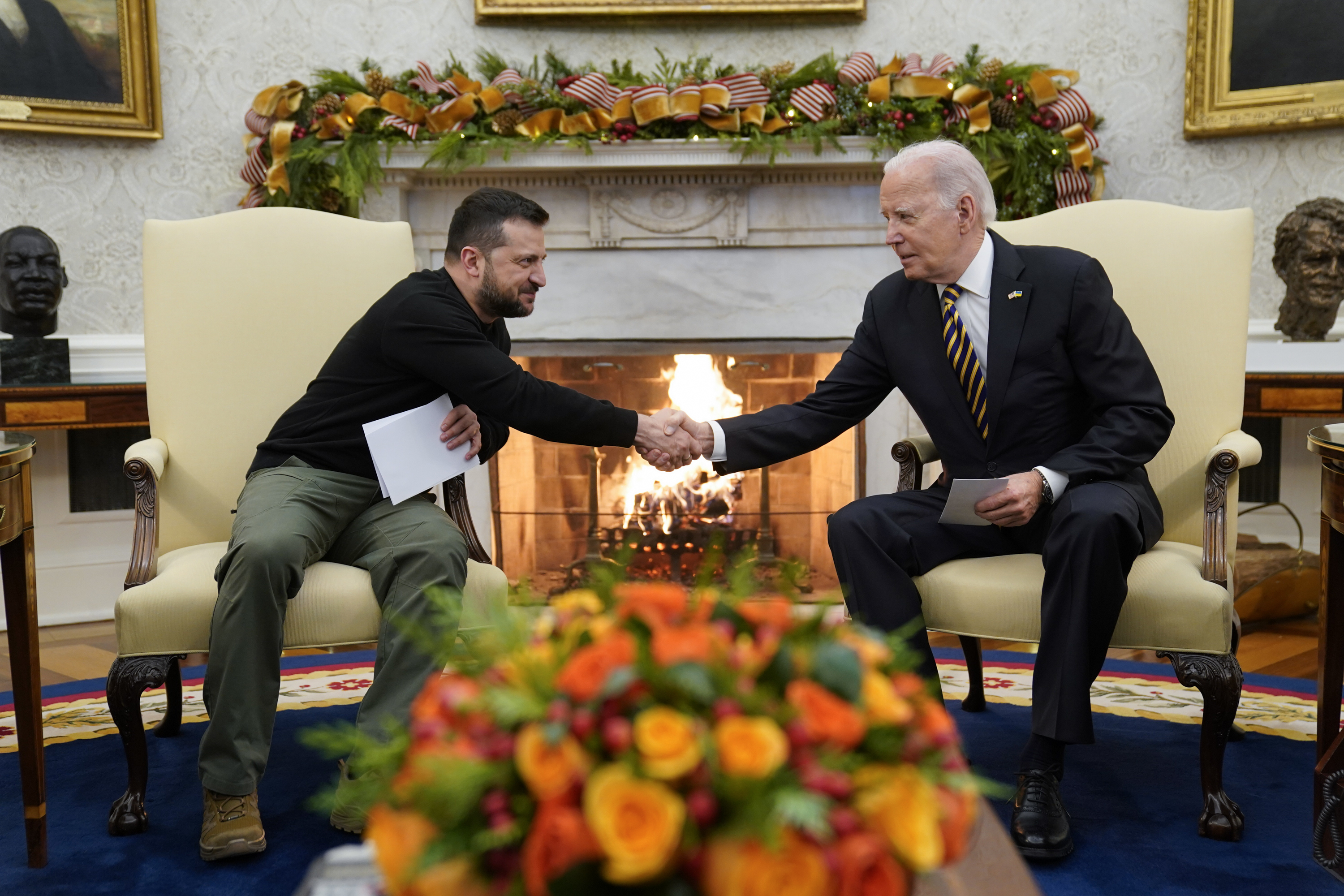 President Joe Biden shakes hands with Ukrainian President Volodymyr Zelenskyy as they meet in the Oval Office of the White House, Tuesday, Dec. 12, 2023, in Washington. (AP Photo/Evan Vucci)