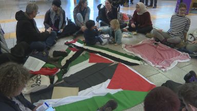 Pro-Palestinian protesters stage sit-in at Scottish Parliament.