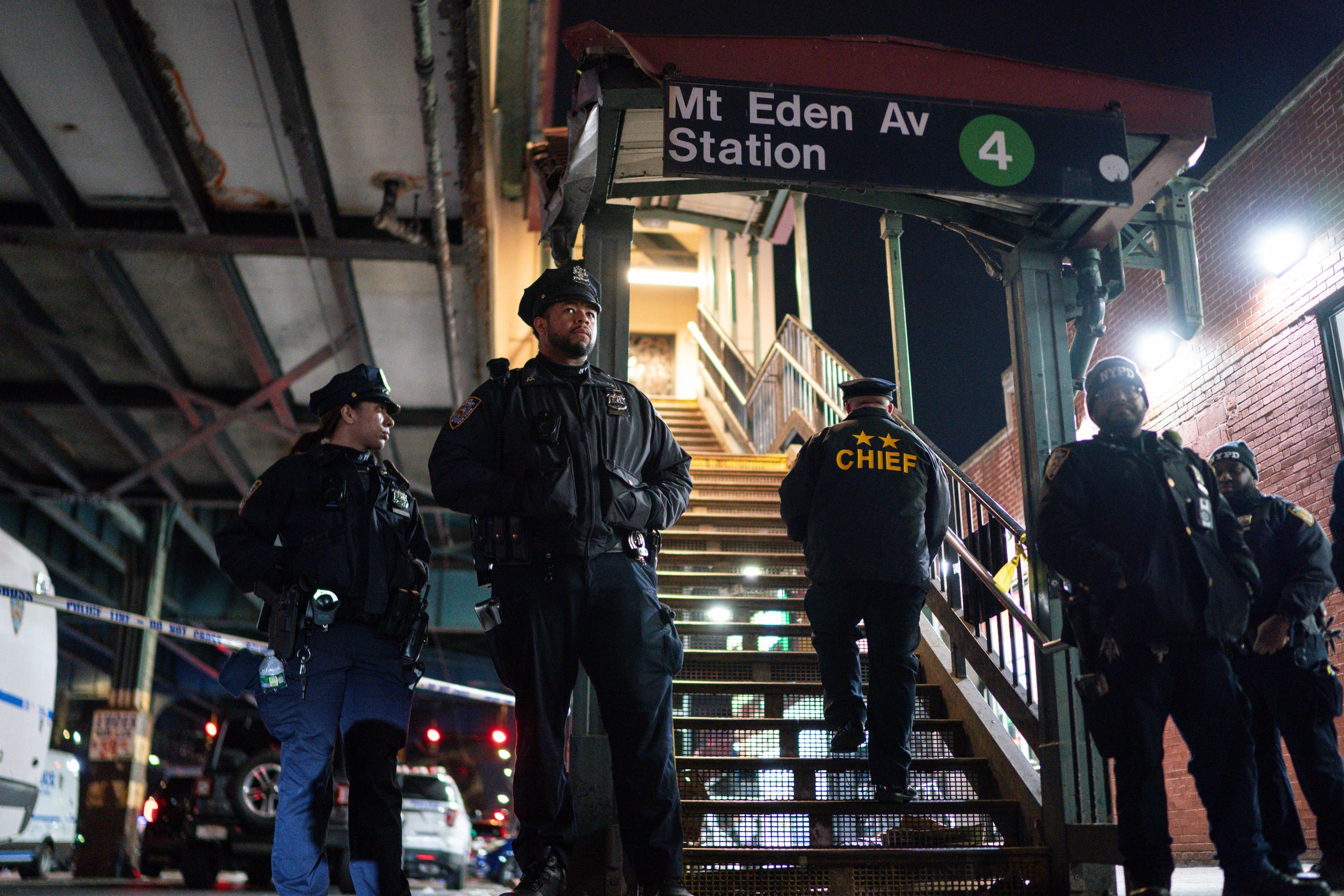 New York City Police officers stand guard following a shooting at the Mount Eden subway station in the Bronx. Photo: Eduardo Munoz Alvarez/AP.