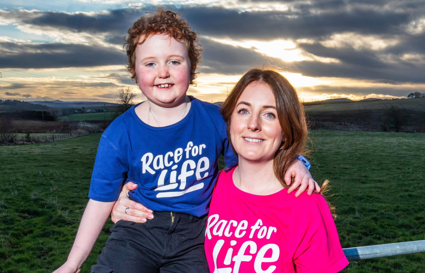 Cancer survivor Aurora Farren, eight, hugs her mum Jenna Farren, 34.