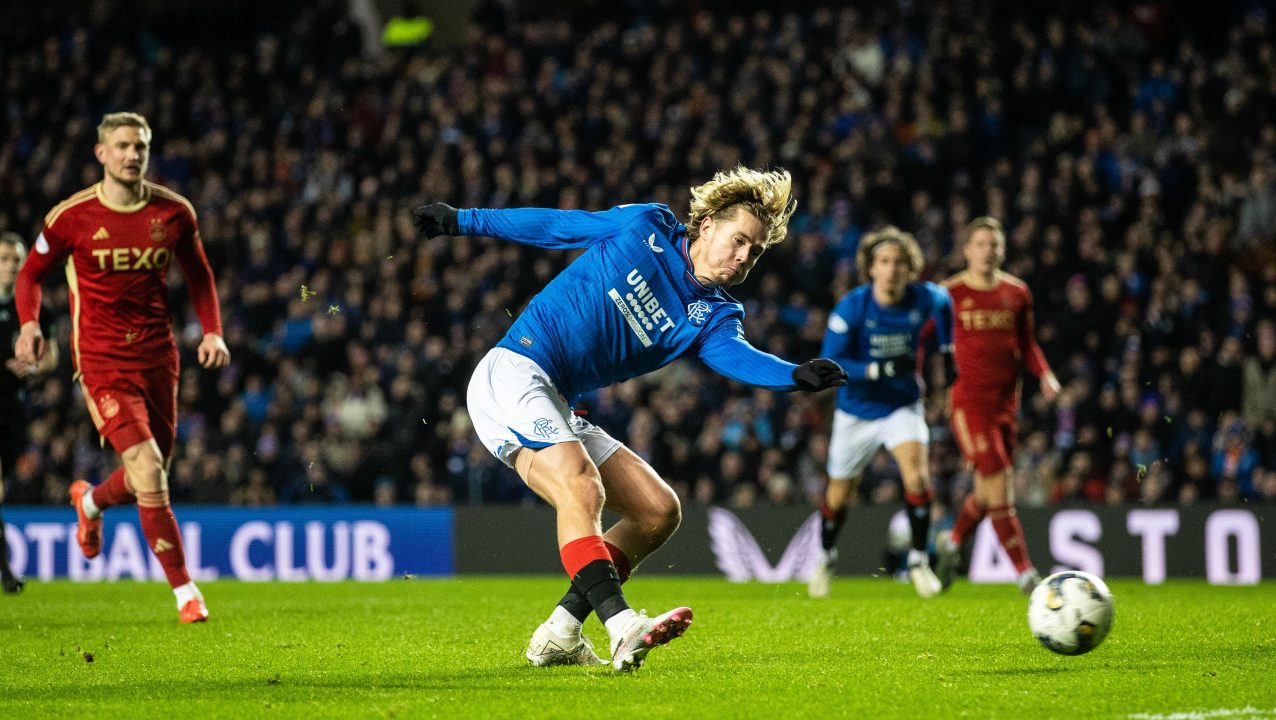 Rangers battle past Neil Warnock’s stubborn Aberdeen to join Celtic at top