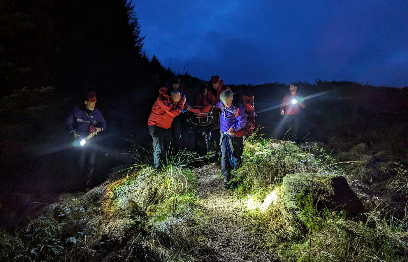 The casualty was packaged into a casualty bag and stretcher before being safely carried from the hillside.