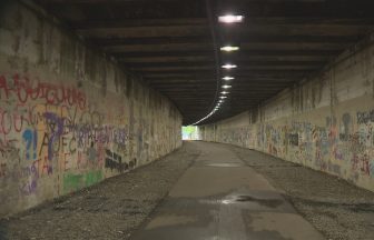 Children brave elements to glimpse progress of Alloway Tunnel mural